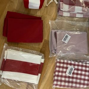 New assorted solid red, red/white pin stripe, square 17” x 17”pillow covers.